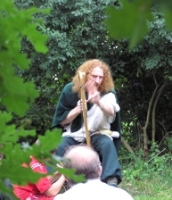 Talesman playing the lyre through trees